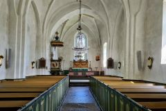 Kor och altargång i Adelsö kyrka. Detalj ur fotografi av Niklas Henriksson